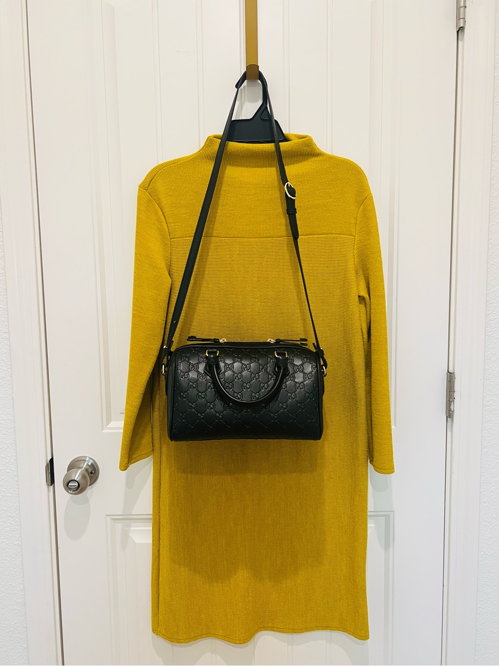 Black Embossed Barrel Satchel with a Strap